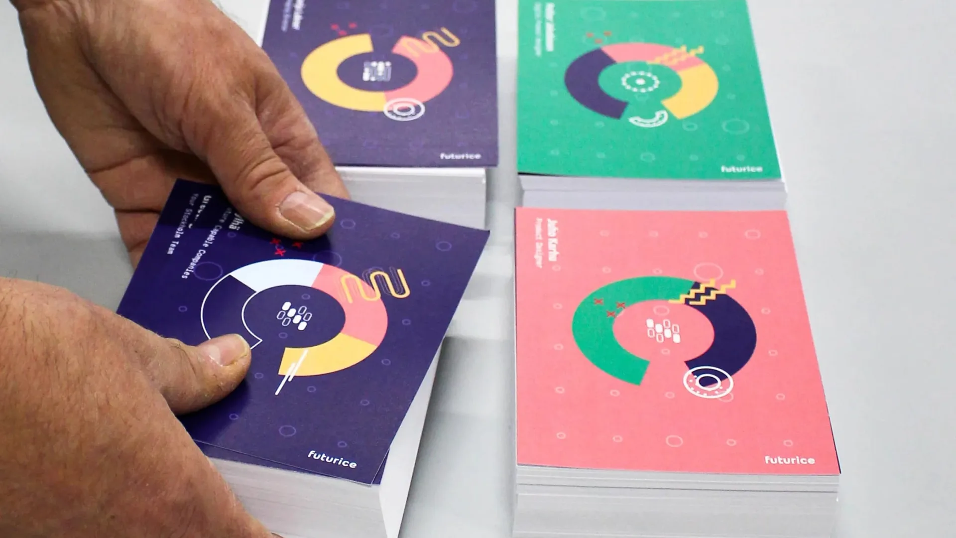 Data Portrait Postcards being stacked by a worker.