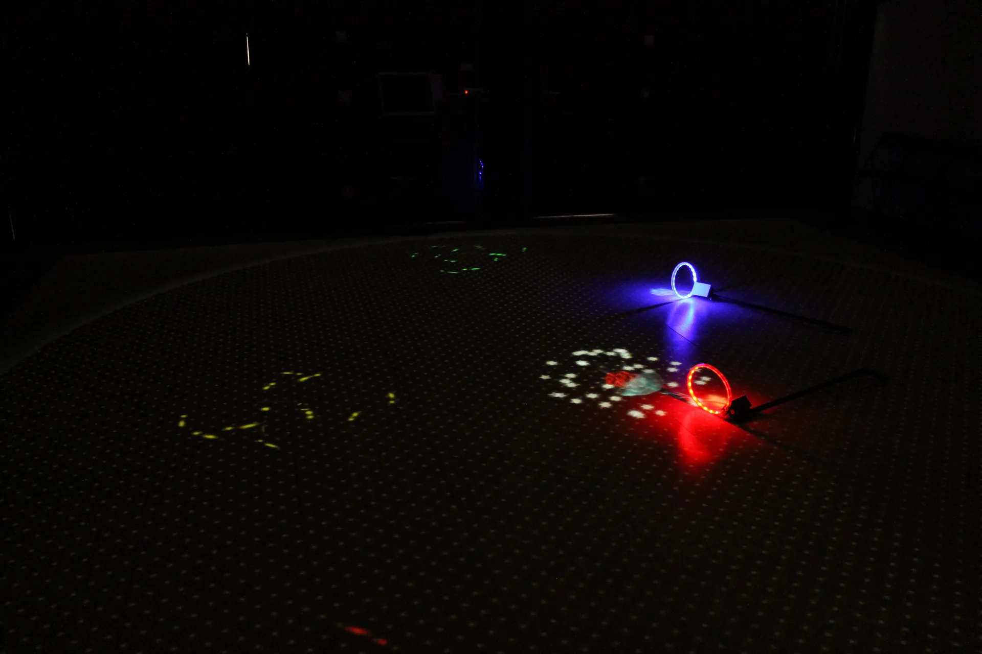 Controllers placed on the projection surface waiting for children to play.